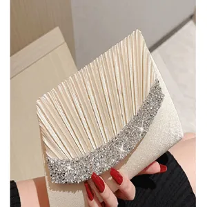 Champagne velvet evening clutch bag with pleated flap and sparkling rhinestones for party.