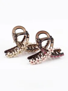 Dettaglio molletta per capelli con fiori e strass, elegante design marrone traslucido per donne.