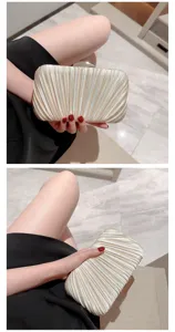 Elegant pleated champagne evening clutch bag for women, perfect for weddings and parties.
