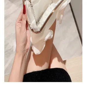Elegant white satin evening clutch bag with metal frame and chain strap for women weddings.