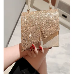 Elegantly crafted glitter evening bag featuring a metallic handle and chic V clasp for women