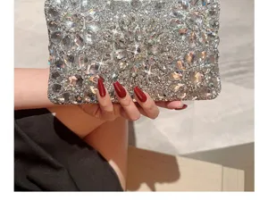Sparkling rhinestone evening clutch bag for women, elegant diamond sunburst design party purse.