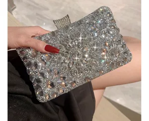 Sparkly rhinestone evening clutch bag with crystal sunburst design for party dress and wedding.