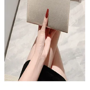Shimmering metallic evening clutch bag detail, elegant party handbag design for women.