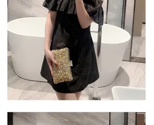 Sparkly gold rhinestone evening clutch bag detail, elegant design for party and wedding events.