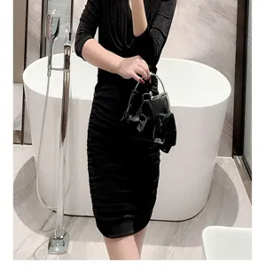 Elegant black evening bag with floral design, metal handle, perfect for party and wedding.