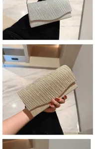 Sparkling pleated evening clutch detail, elegant wedding party chain bag close-up.