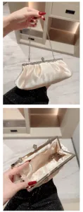 Elegant satin evening clutch bag with metallic chain and rhinestone clasp for party dress.