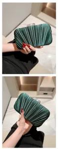 Elegant emerald green pleated satin evening clutch bag with metallic clasp for formal events.
