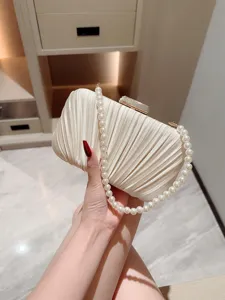 Elegant pleated satin evening clutch bag with pearl handle for women party wedding dress.
