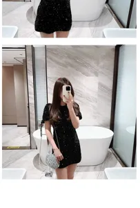 Detailed view of the sparkling sequin evening clutch and stylish party dress in a modern setup.