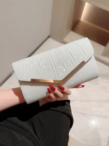 Silver pleated evening clutch bag with metallic V-shaped clasp, elegant party shoulder purse.