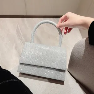Silver glitter handbag with top handle and flap closure for women fashion evening party