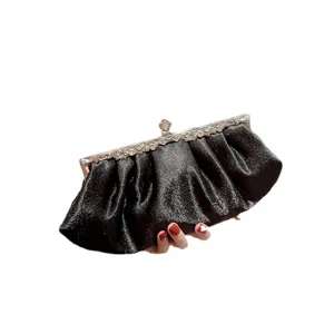 Elegant black satin evening clutch bag for women, perfect for parties and formal events.