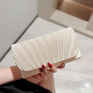 Elegant champagne pleated clutch bag for women, chic evening party handbag handheld accessory.