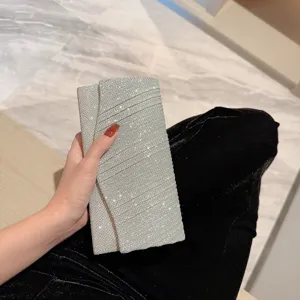 Silver glitter evening clutch bag for women, elegant envelope handbag for party and wedding.