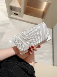 Elegant silver pleated evening clutch bag for women, stylish shoulder bag for party events.