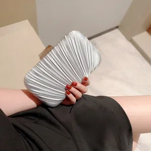 Elegant silver pleated evening clutch bag with metal clasp for women parties and wedding events.