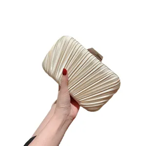 Elegant champagne pleated evening clutch bag, perfect versatile purse for formal party dresses.