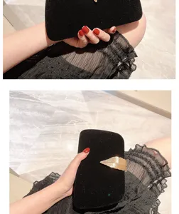 Elegant velvet evening clutch bag with gold leaf decoration for women banquets, parties, and dresses.