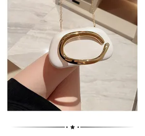 Elegant white evening clutch bag with luxury gold metal C-shape hardware and chain strap.