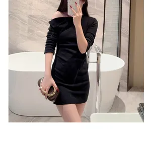 Elegant black evening dress paired with luxury metal ring handle clutch bag for parties.