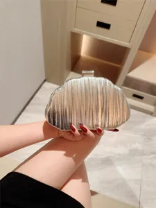 Silver metallic pleated evening clutch bag for women, elegant wedding party purse accessory.