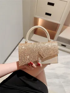 Sparkly gold evening handbag with metal V clasp main image showcasing elegant party purse design