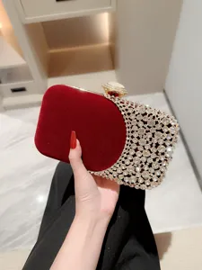 Elegant red velvet evening clutch bag with sparkling crystal rhinestones and chic metal clasp.