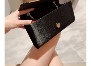 Elegant black glitter evening clutch bag with metallic clasp and chain for women wedding.