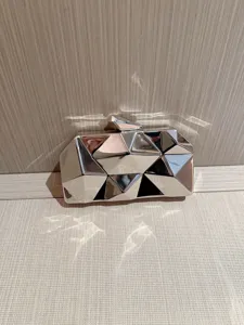Silver metallic geometric clutch bag, shiny mirror evening purse for parties and formal dress.