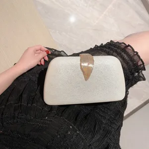 Elegant sparkling evening clutch bag with gold leaf clasp for women party wear main view