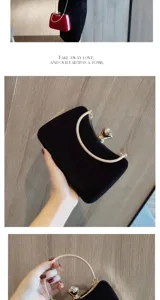 Close-up detail of luxury black velvet evening clutch bag with crystal clasp and metal handle.