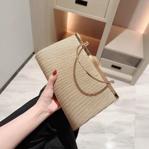 Shining pleated evening clutch bag for women, elegant gold handbag for parties and dress events.
