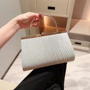Elegant silver glitter pleated evening clutch bag with metal round handle for women parties.