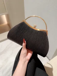 Black pleated evening clutch bag with gold round handle and rhinestone clasp for women main view