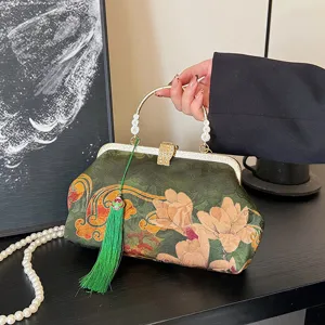 Chinese style embroidered evening bag clutch purse with metal handle and elegant green tassel