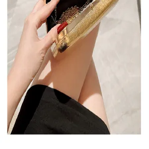 Exquisite metallic gold evening clutch bag with chain, elegant design for party and wedding.