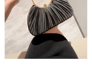 Elegant black satin pleated evening bag with a metallic round handle, exquisite party accessory.