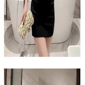 Elegant pearl beaded evening clutch bag with sparkly rhinestones for women parties.