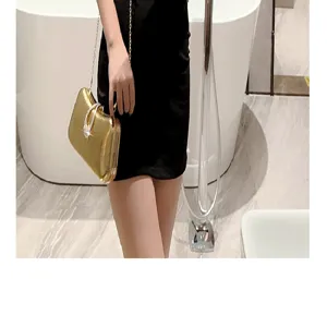 Golden metallic evening clutch bag with crystal waterdrop clasp for women party dress.
