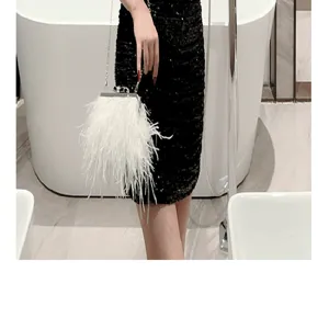 White feather evening bag with chain strap, elegant shoulder handbag for weddings and parties.