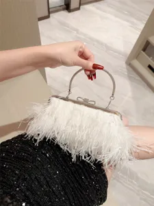 Elegant white feather evening clutch bag with metallic round handle for weddings and parties.