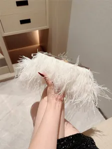 Elegant white feather evening bag for women, luxury wedding handbag with chain and metal clasp.
