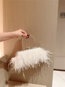 White feather evening clutch bag with metal handle and rhinestone bow for women party main