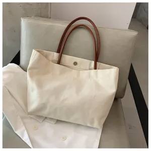 Sac cabas en toile minimaliste avec poignées en cuir marron, grand sac de transport quotidien.