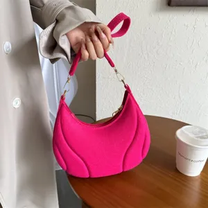 Stylish trendy pink pleated underarm bag for women, chic french shoulder handbag with chain detail.
