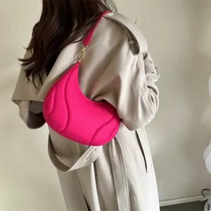 Pink crescent shoulder bag detail, stylish French underarm handbag for women fashion.