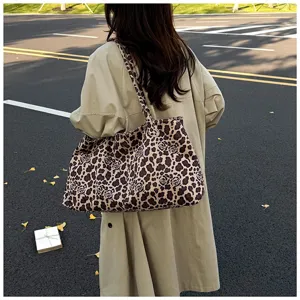 Detailed view of the stylish leopard print tote bag, showcasing large capacity and casual design.