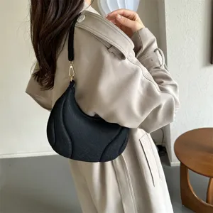 Textured French underarm bag for women, stylish pleated shoulder bag for daily commuting.